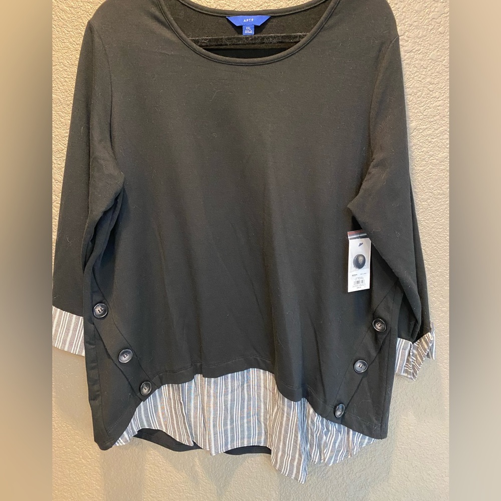 Black women’s long sleeve, top with blouse type skirting. NWT